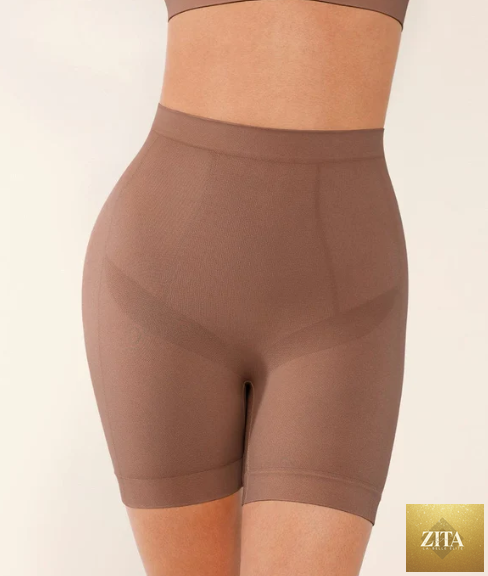 Seamless form-fitting mid-rise tummy control shorts in black, designed to shape and smooth the waist and hips.