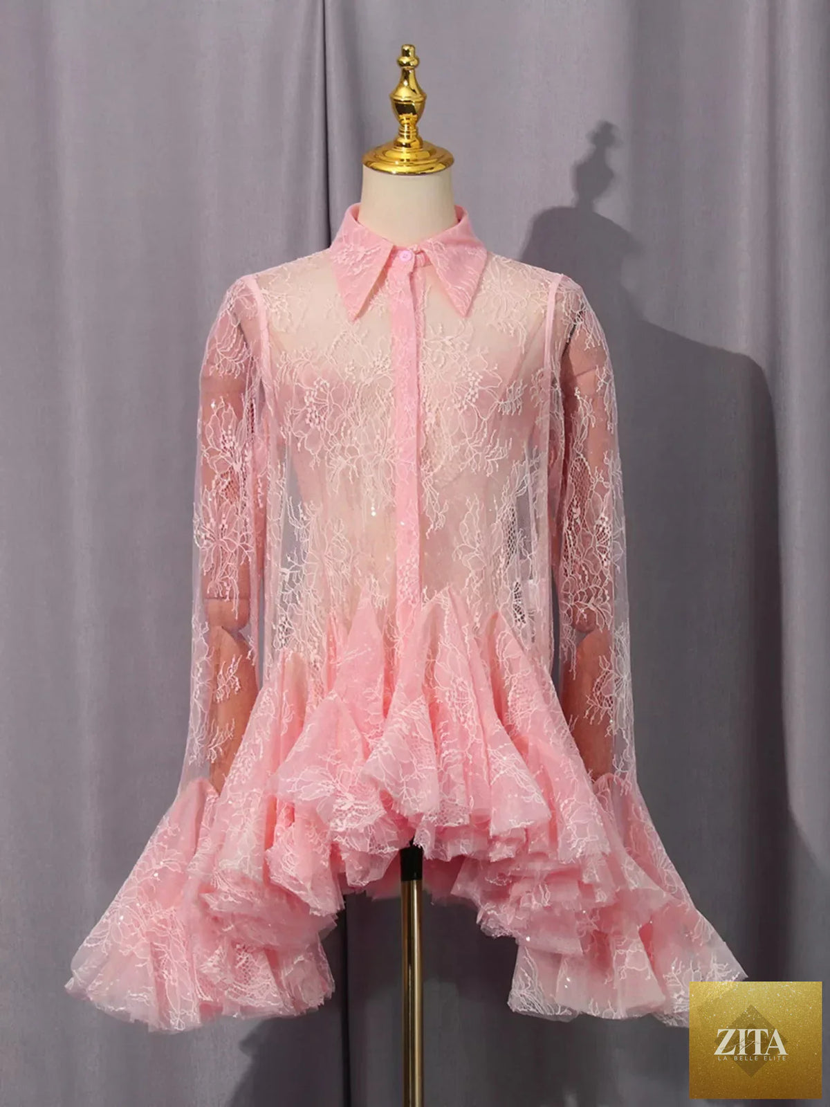 Lace long sleeve dress with ruffled hem, stylish design from Shopiebay, featuring intricate lace details and a flowing silhouette.