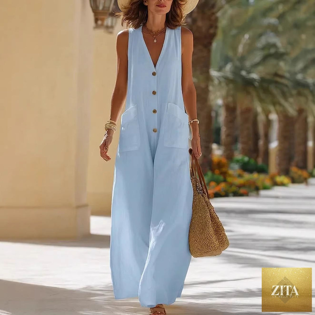 Women's sleeveless cotton-linen wide-leg jumpsuit with button pockets, casualwear by FitiqueFit, shown in a relaxed fit style.