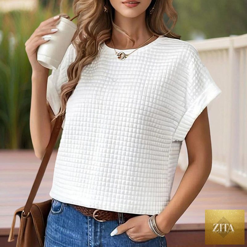 Women’s textured cuff short-sleeve casual tee by FitiqueFit, showcasing a relaxed fit and soft fabric with textured sleeve cuffs.