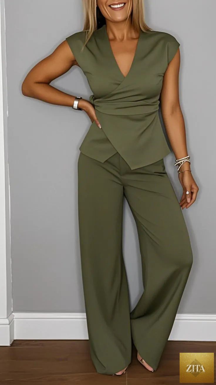 Women's pleated vest and pants set with metal buckle detail from Zita La Belle Elite, casualwear ensemble, front view.