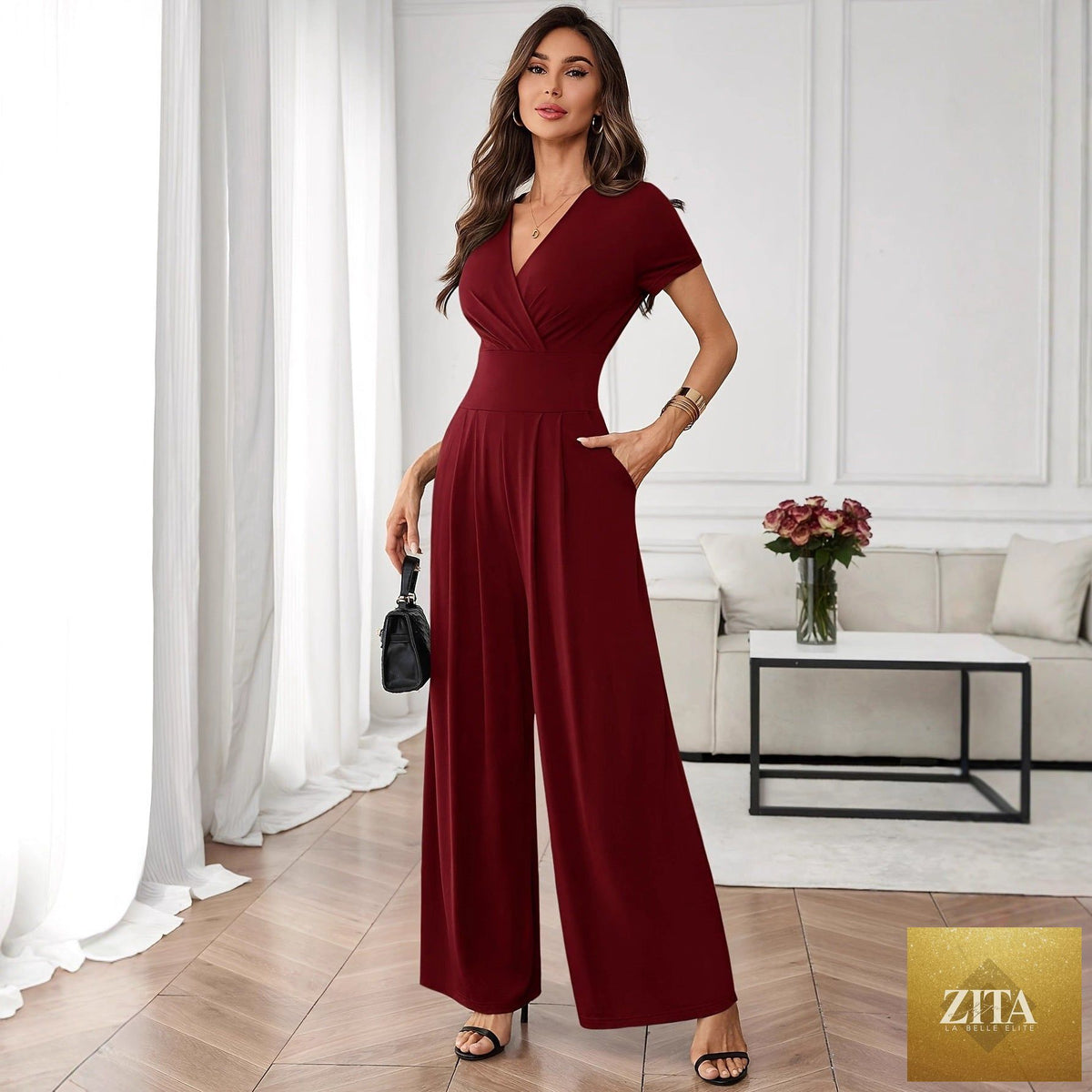 Three-quarter sleeve pleated wide-leg jumpsuit by FitiqueFit in two colors, featuring a relaxed fit and stylish design.