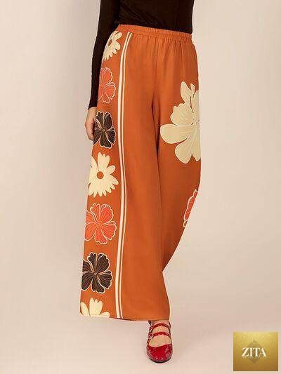 Printed elastic waist wide-leg pants by Selvanelle featuring a comfortable fit and stylish design.