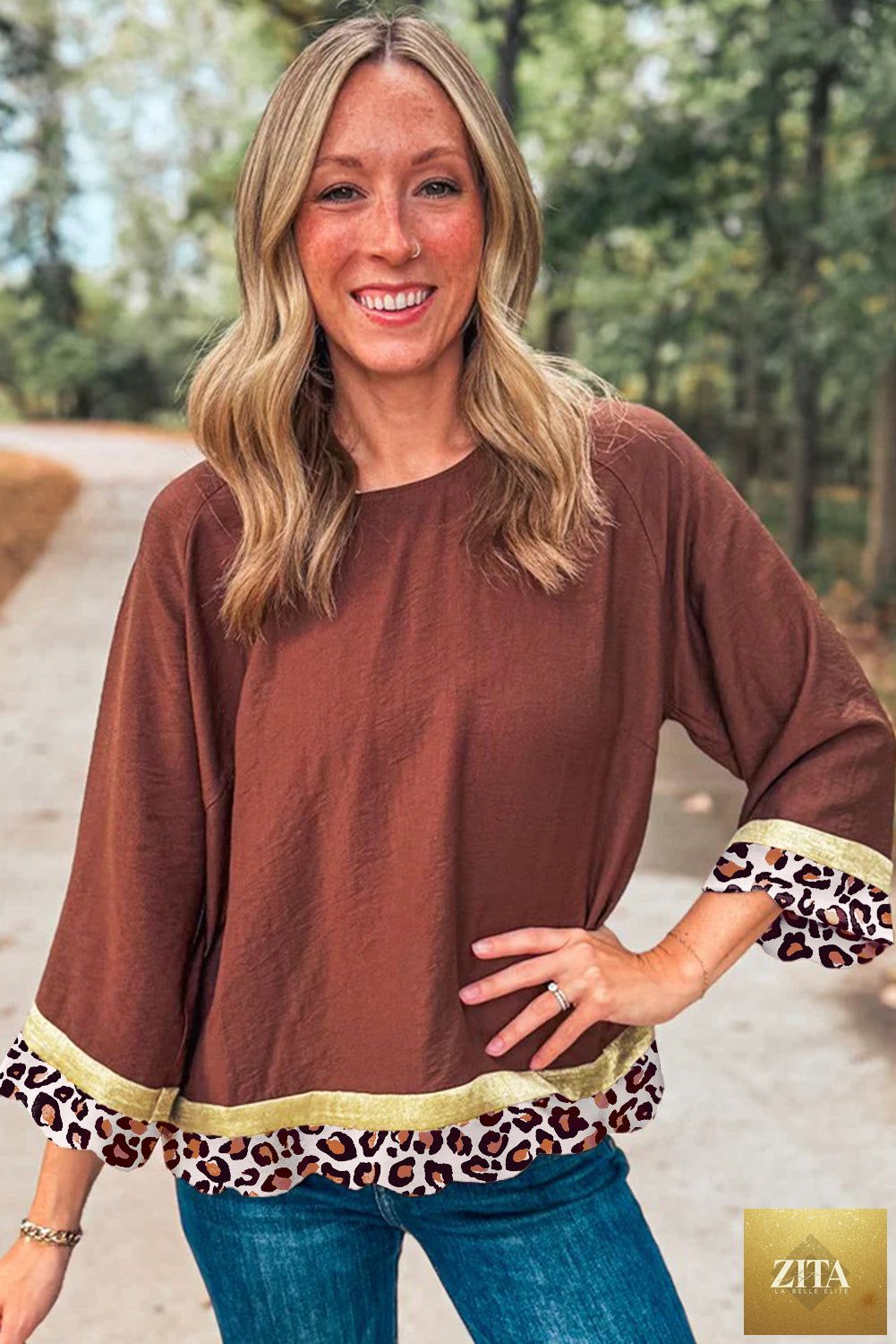 Wild and Free Boutique clay-colored long sleeve top with leopard detail and loose fit, featuring bracelet-length sleeves.