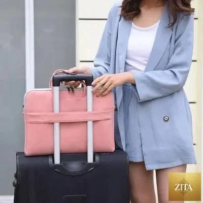 Mandotos women's PU leather laptop bag with shoulder strap and handles, fits MacBook Air 13.3 to 15.6 inches, with space for accessories.