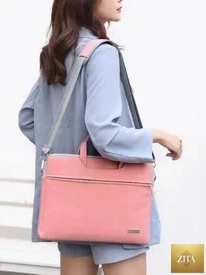 Mandotos women’s PU leather laptop bag with shoulder strap, fits MacBook Air 13.3, 14, 15.6-inch, includes carrying handles and space for accessories.