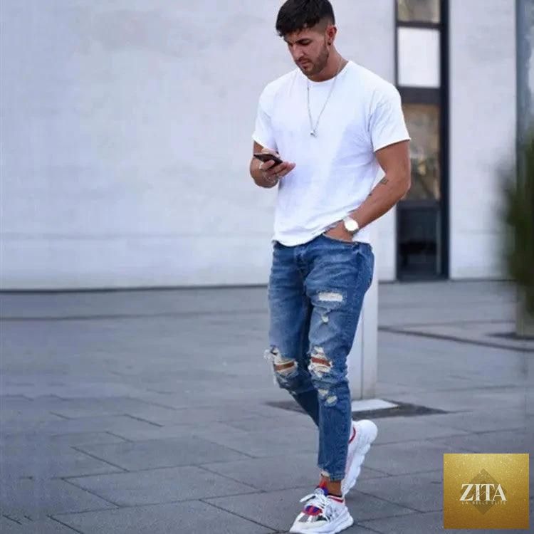 Mandotos men's hole jeans showing distressed denim with ripped details and classic five-pocket design.