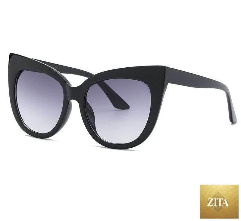 Women's oversized cat eye sunglasses by FitiqueFit with UV400 protection, stylish black frames and tinted lenses.