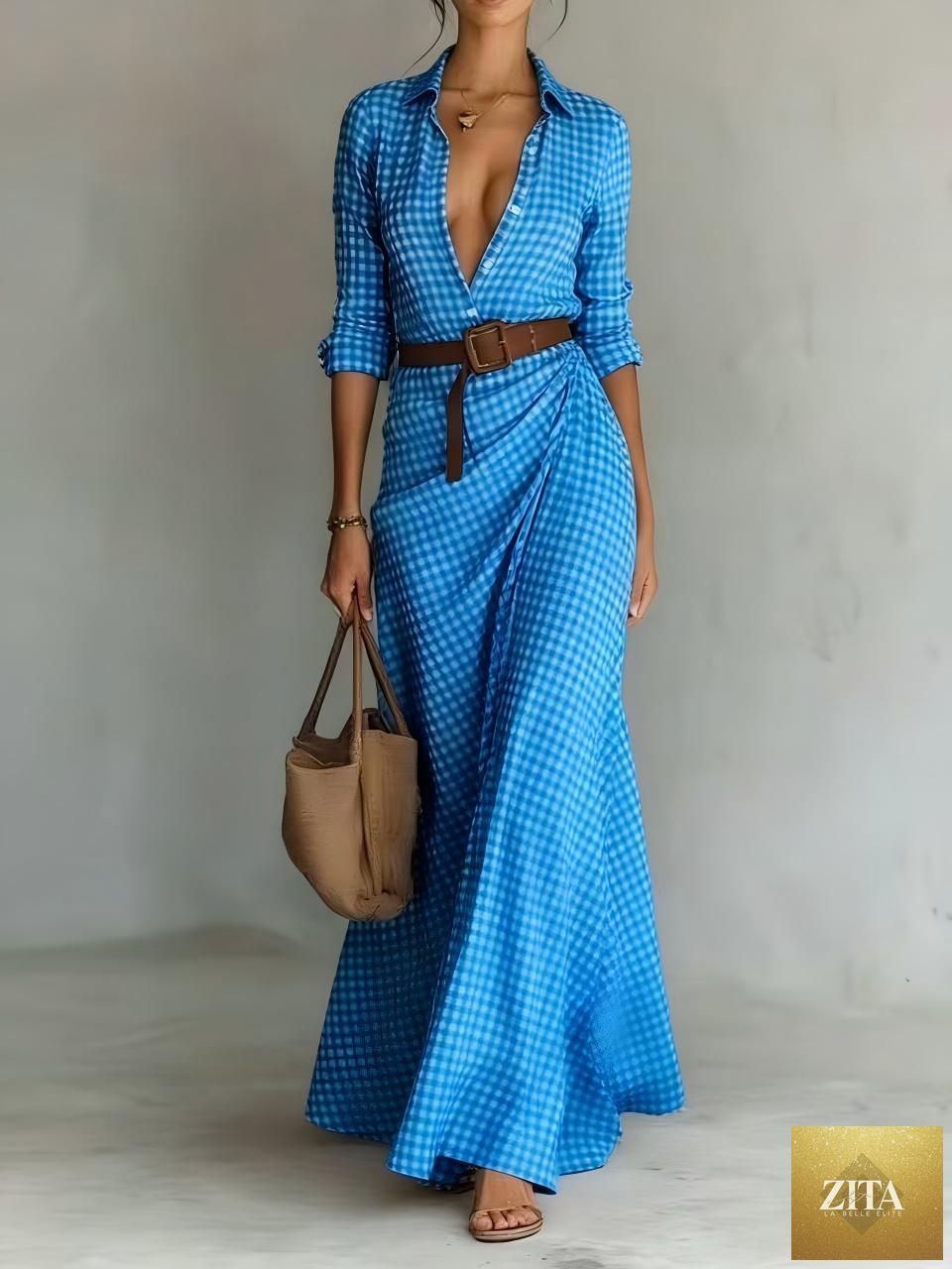 Women's belted irregular pleated dress by FitiqueFit featuring a stylish design and flowing fabric on a model.