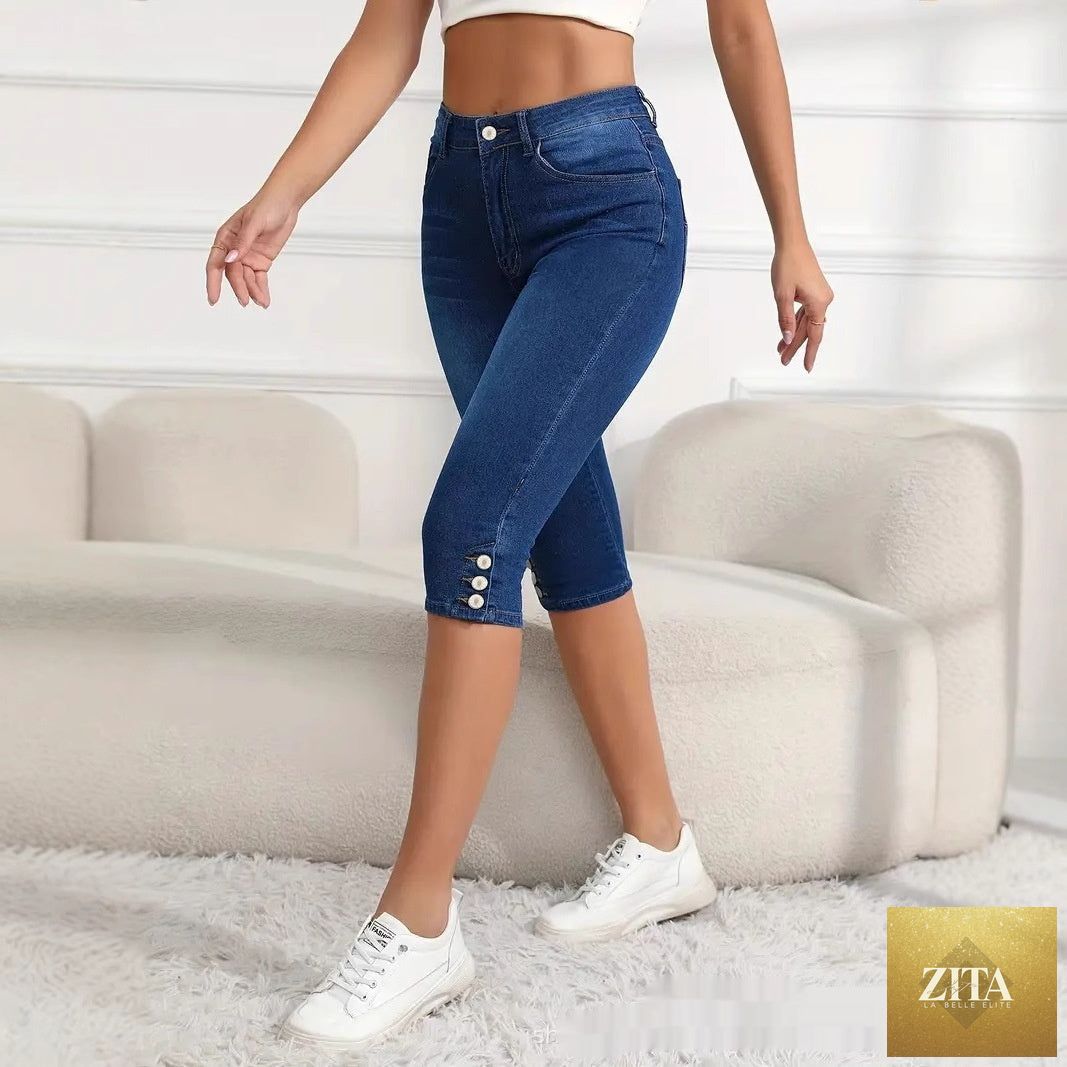 Plus-size women's slim-fit Capri pants from My Store, featuring a versatile design and comfortable fit, shown in a casual setting.