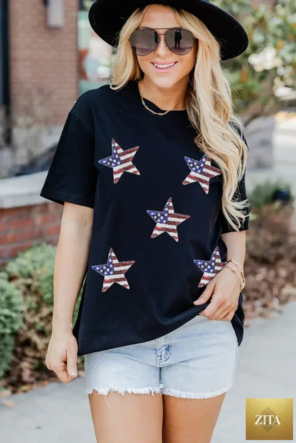 Black sequined American flag star graphic T-shirt by Femstylo, featuring bold star and flag design on soft cotton tee.