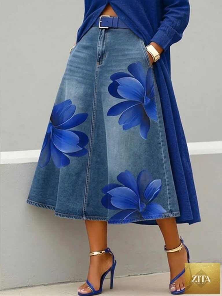 Women's floral print denim-style boho A-line midi skirt by FitiqueFit, showcasing the flowy design and vibrant floral pattern.