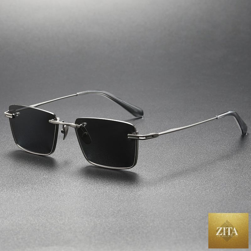 Pure titanium polarized sunglasses in retro British style, sleek eye wear with dark tinted lenses and thin metal frames.