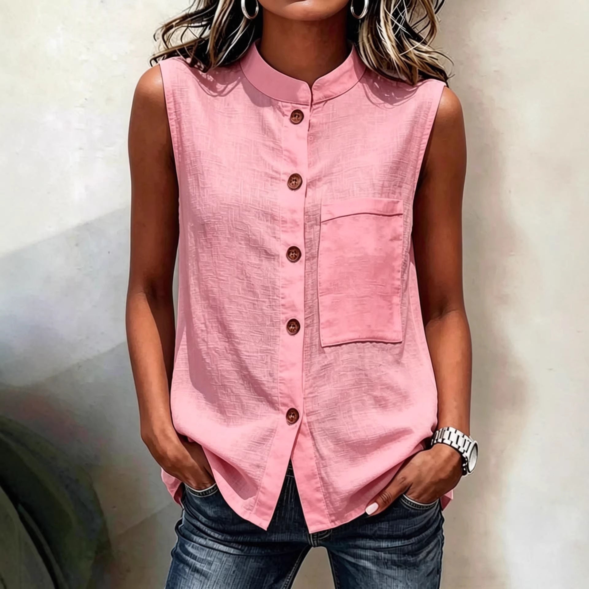 Women's sleeveless crop top with buttoned pockets in solid color, casualwear by FitiqueFit, shown in water-themed setting.