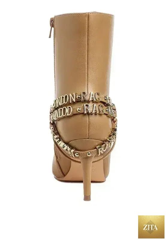 Femstylo buckle harness stiletto boots with a 3-inch heel, featuring a sleek black design and fashionable ankle strap detail.