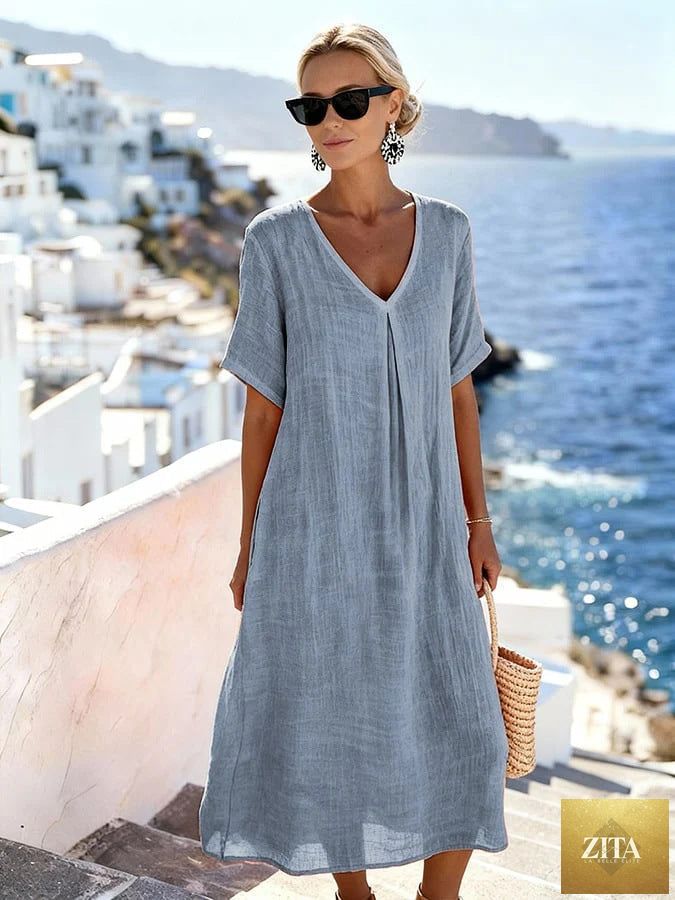 Patchwork asymmetrical maxi dress by FitiqueFit featuring a relaxed V-neck style and colorful patchwork design.