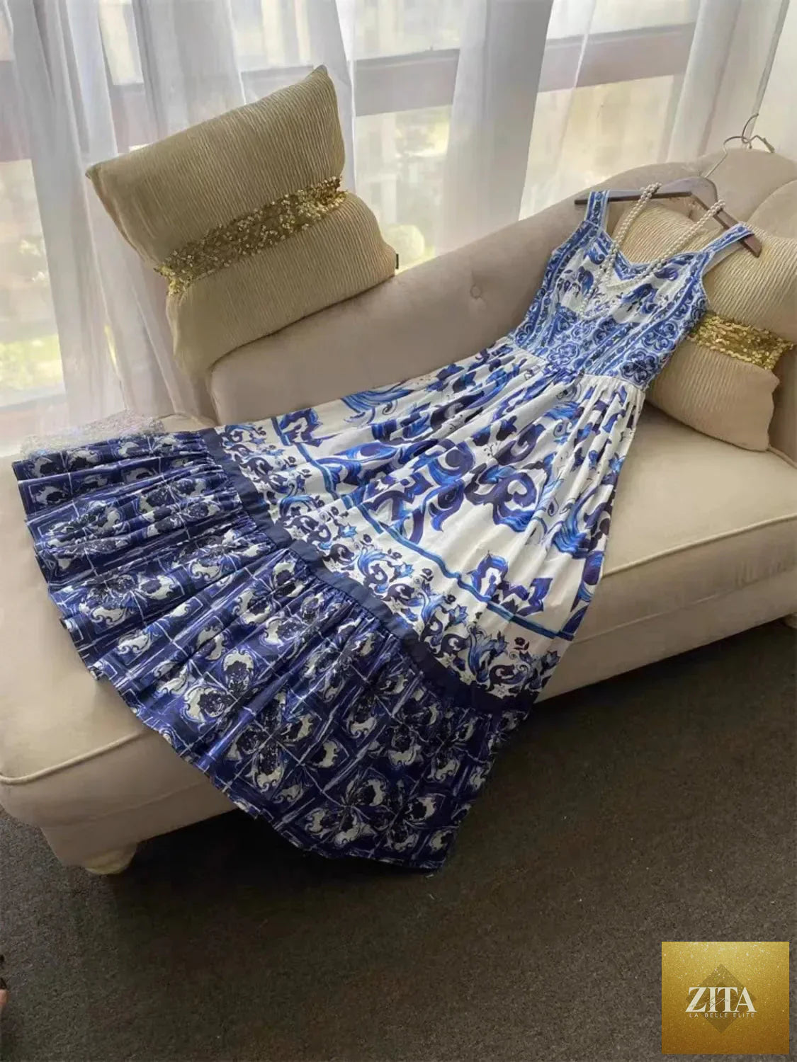 Smocked printed wide strap dress by Shopiebay featuring a flowy design and vibrant floral pattern, perfect for casual wear.