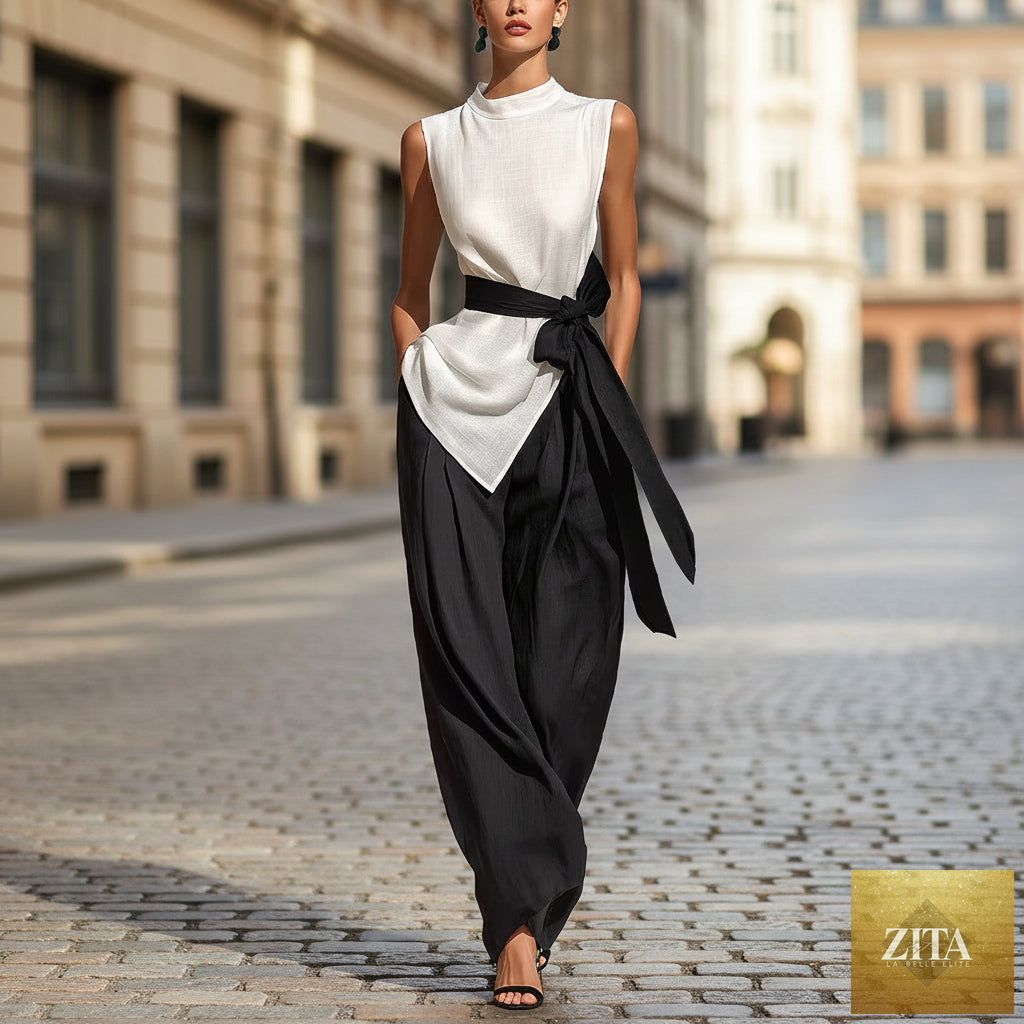 White women's lace-up sleeveless top and wide-leg pants two-piece casualwear set by Zita La Belle Elite, shown on a model.