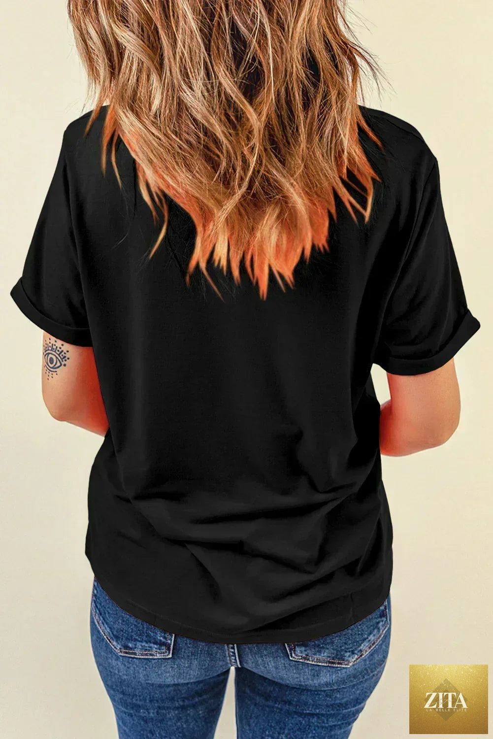 Black sequined American flag star graphic T-shirt by Femstylo featuring bold patriotic star design and shimmering sequins.