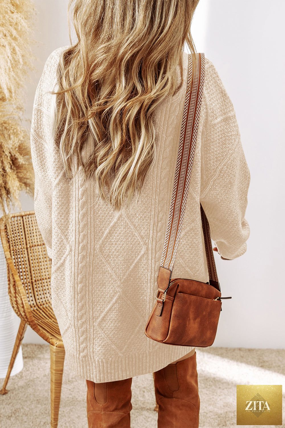 Oatmeal cable knit drop shoulder sweater dress by Unique Oils, loose fit with cozy, textured knit fabric and oversized style.