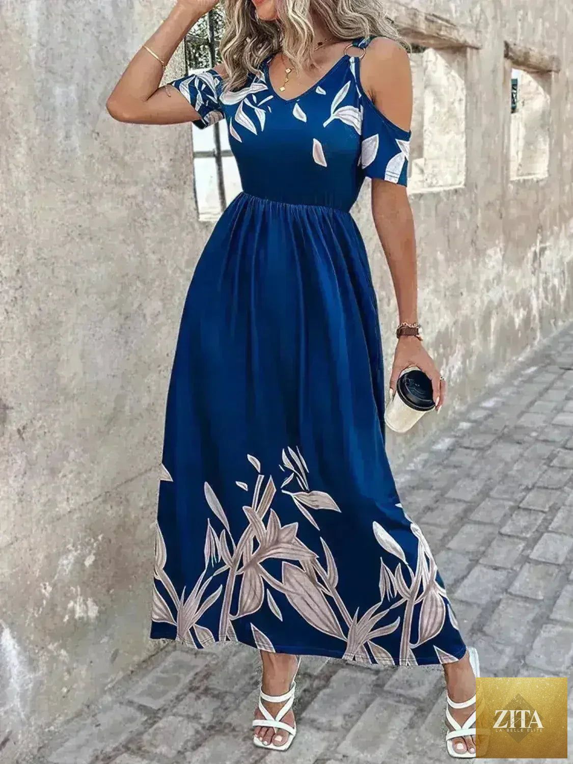 Femstylo printed cold shoulder maxi dress in polyester, featuring a stylish design with flowy fabric and elegant shoulder cutouts.