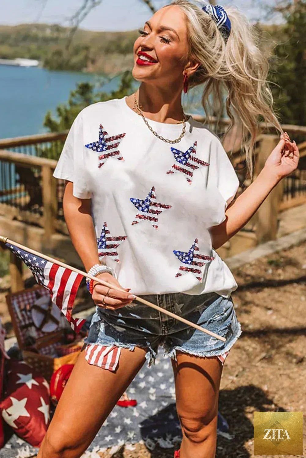Black sequined American flag star graphic T-shirt by Femstylo featuring bold star and flag design on soft fabric.
