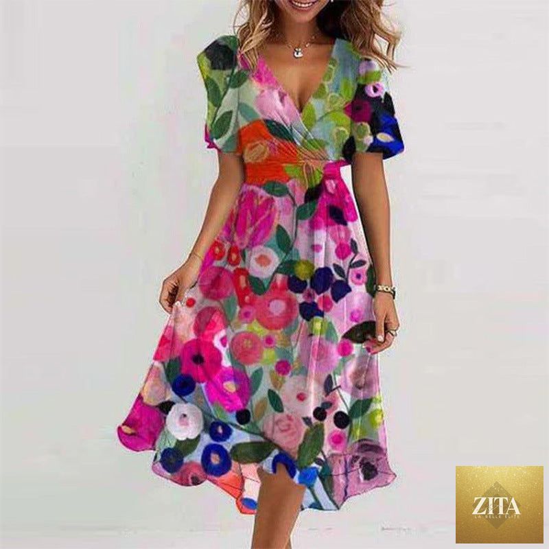 Floral print FitiqueFit A-line V-neck short sleeve midi dress displayed on a model, showcasing its elegant design and vibrant pattern.