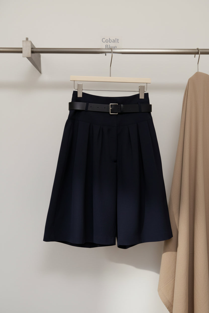 Light beige FitiqueFit relaxed A-line cotton midi skirt with crushed pleats and a belt, casualwear style featured in the image.
