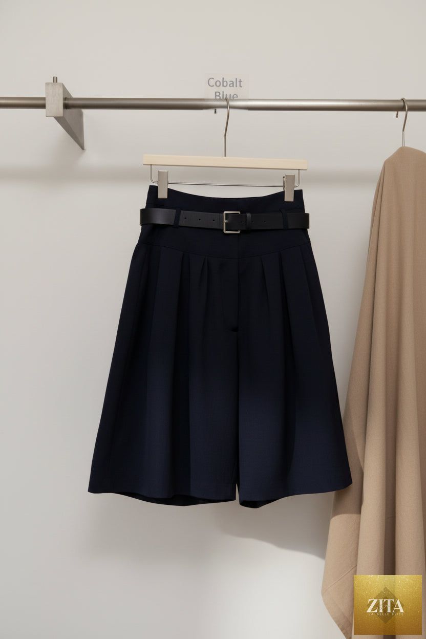 Zita La Belle Elite relaxed A-line cotton midi skirt with crushed pleats and belt, casualwear style, shown in natural fabric detail.