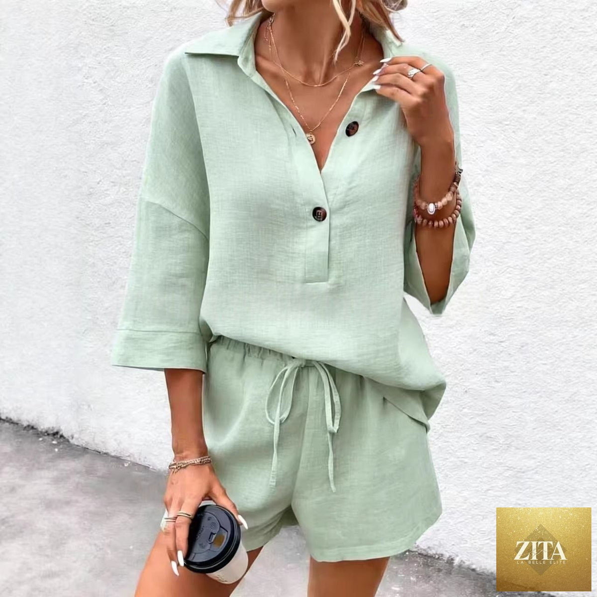 Zita La Belle Elite women's two-piece set with a notch-lapel short-sleeve top and belted shorts, stylish and comfortable ensemble.