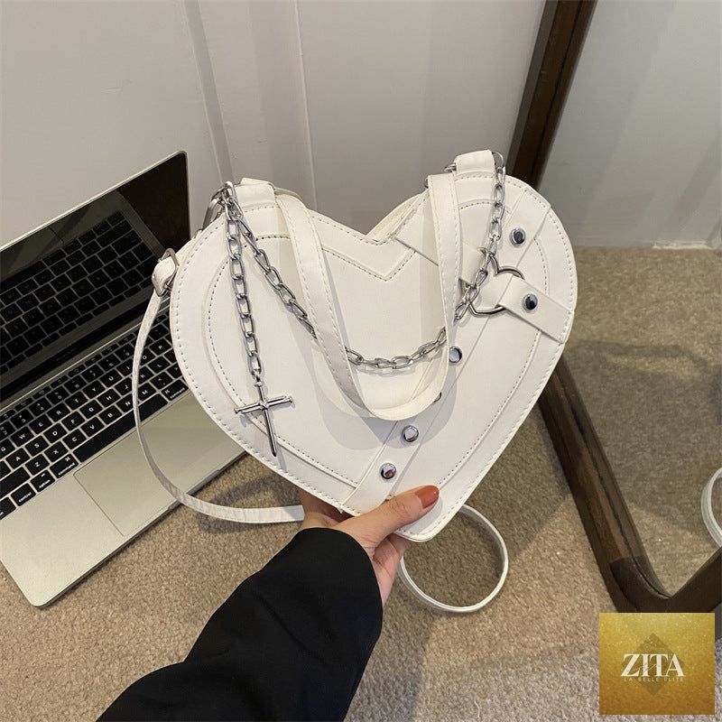 Korean-style cute heart-shaped shoulder crossbody bag with niche design, featuring social buzz branding and adjustable strap.