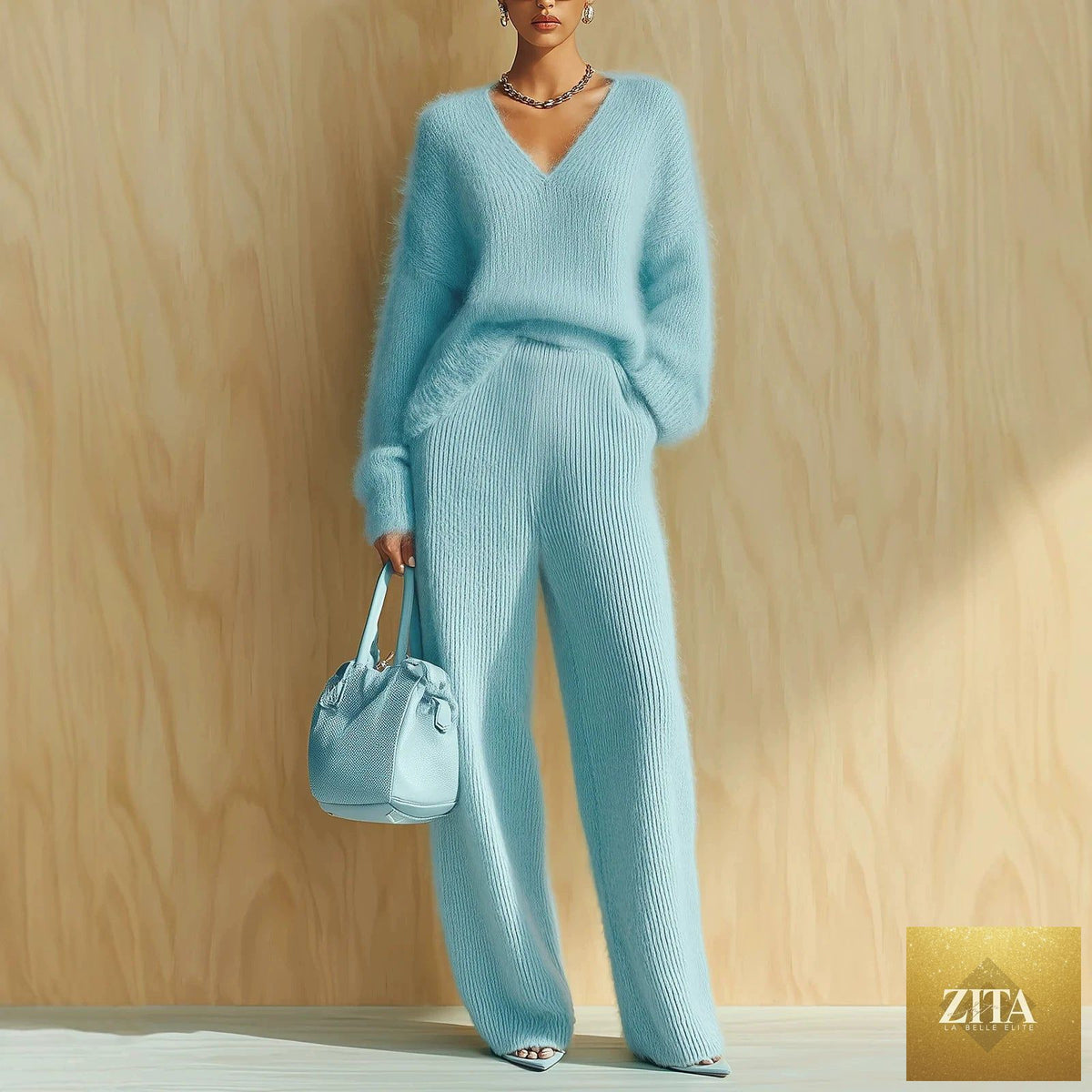 Women's fluffy V-neck oversized sweater and wide-leg knit trouser set by MERIDGE, featuring soft fabric and relaxed fit.