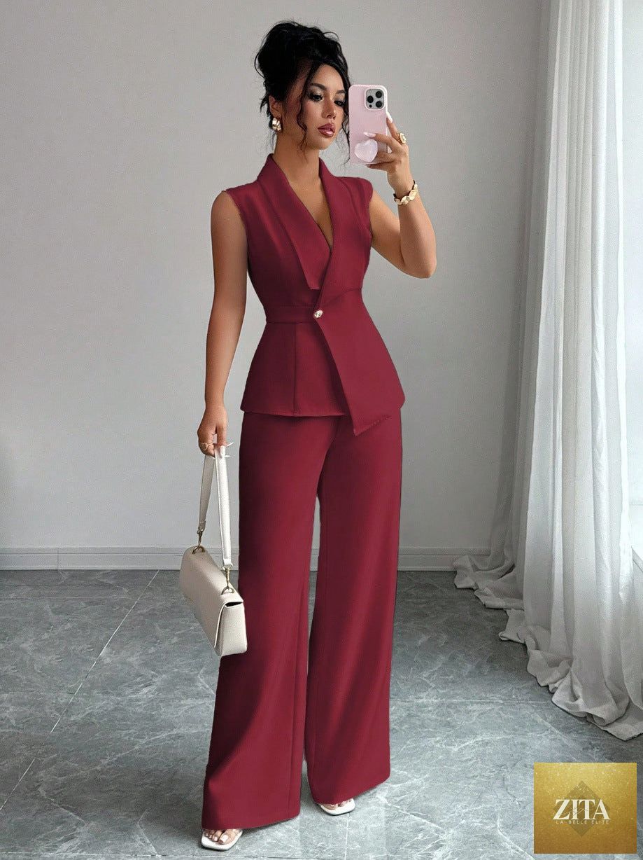 Women's MERIDGE peplum sleeveless blazer and wide-leg pants two-piece set, shown on a model, featuring a stylish, modern design.