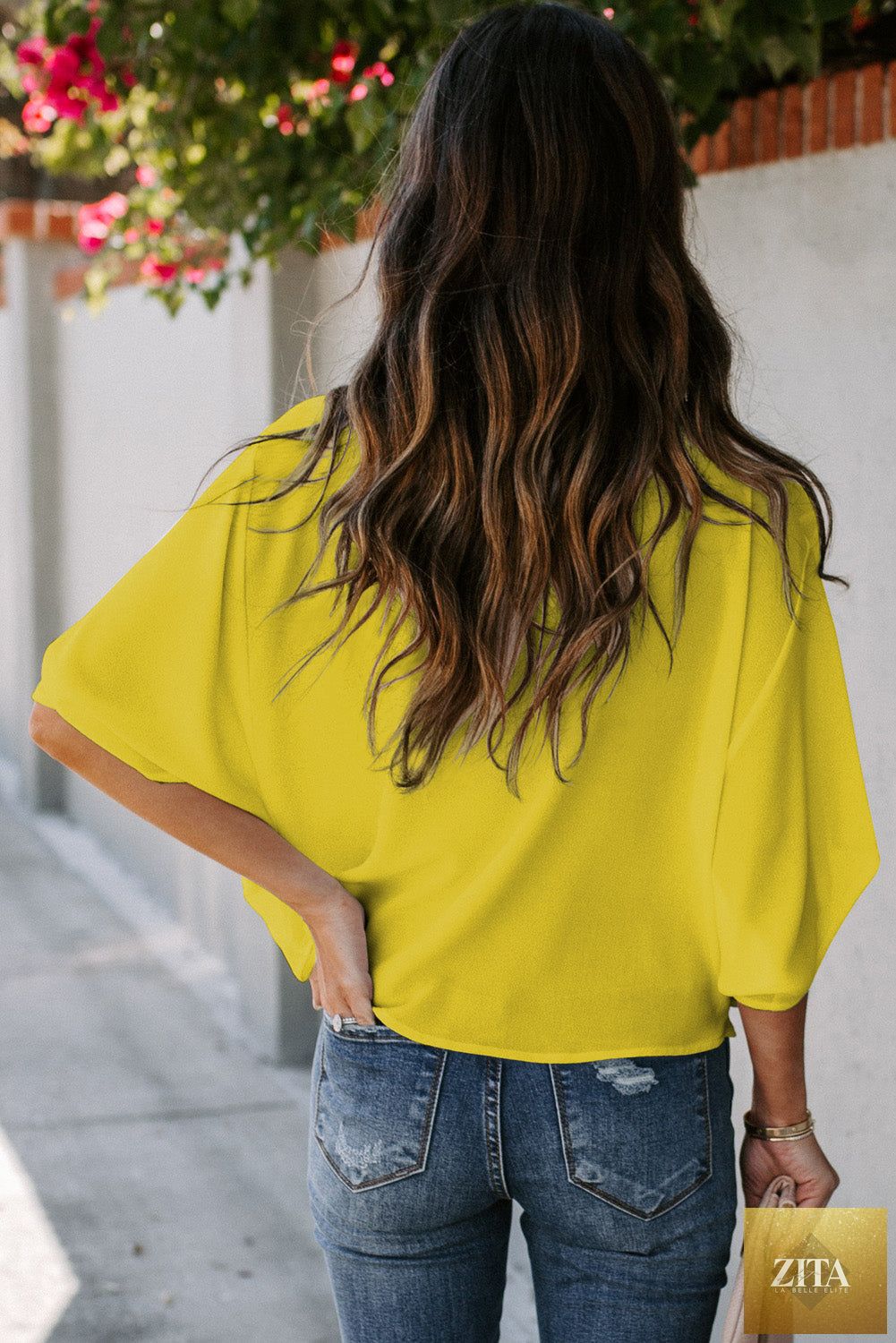 Golden Glow women's casual summer blouse with V-neck, wrap design, and draped sleeves, featuring a stylish and comfortable fit.