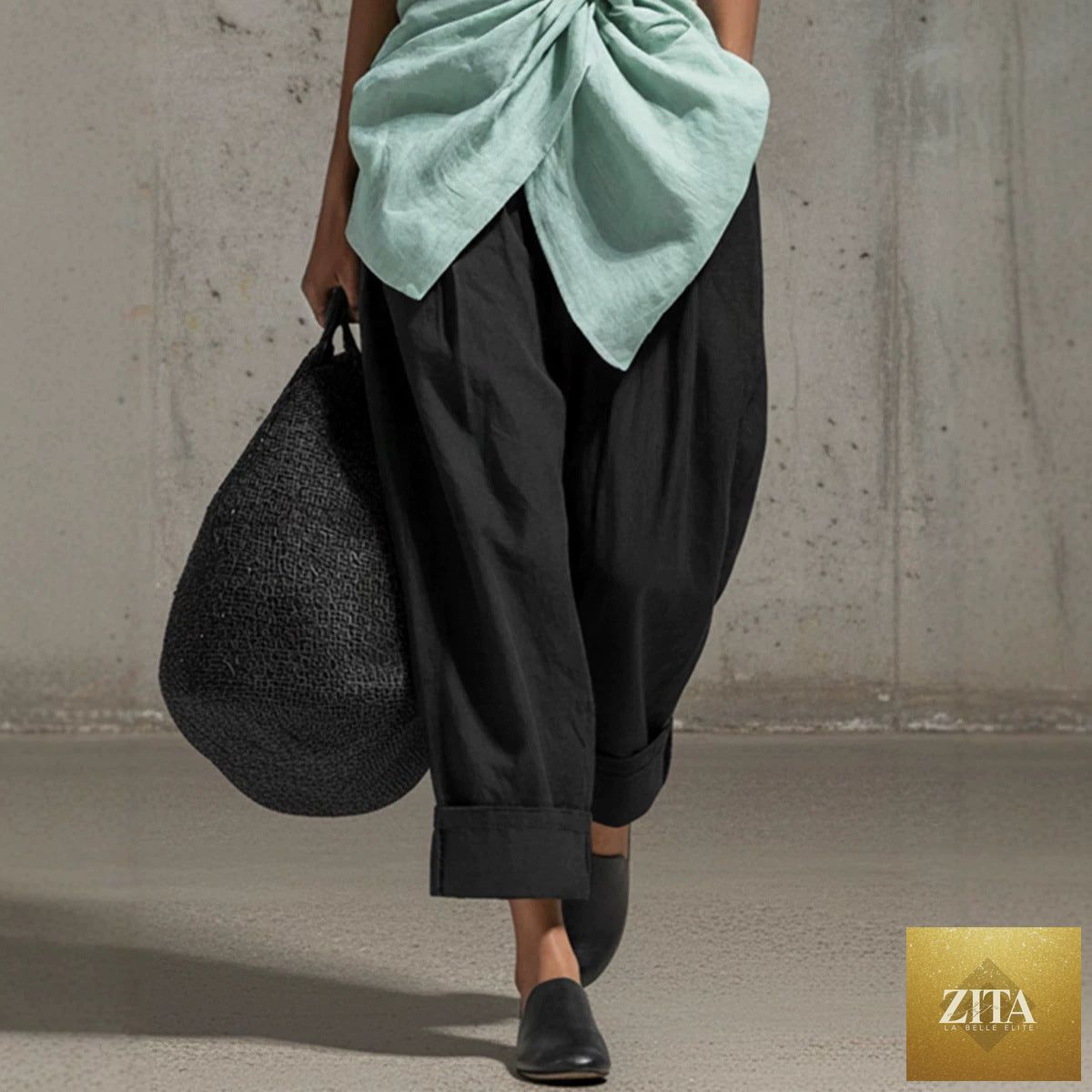 Women's casual-fit tie-front V-neck sleeveless top and wide-leg pants set by FitiqueFit, featuring a stylish, relaxed look.
