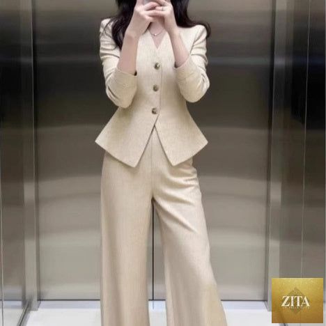 Beige coat and wide-leg pants set from FitiqueFit, stylish waist-grabbing coat paired with matching wide-leg trousers.