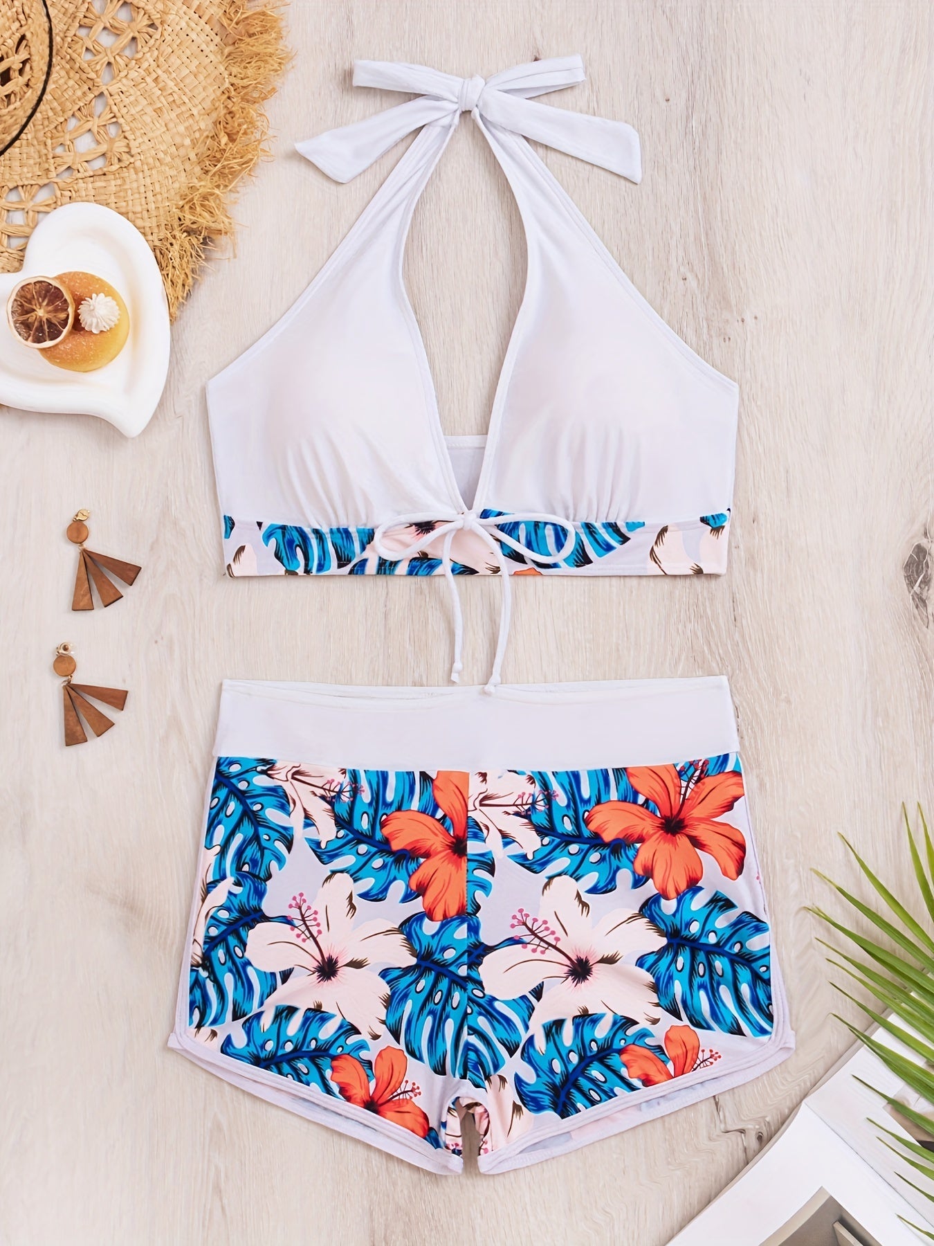 Stevvex floral halter neck bikini set with backless design, tie-neck bow, high waist shorts, perfect for beach and pool summer swimwear.