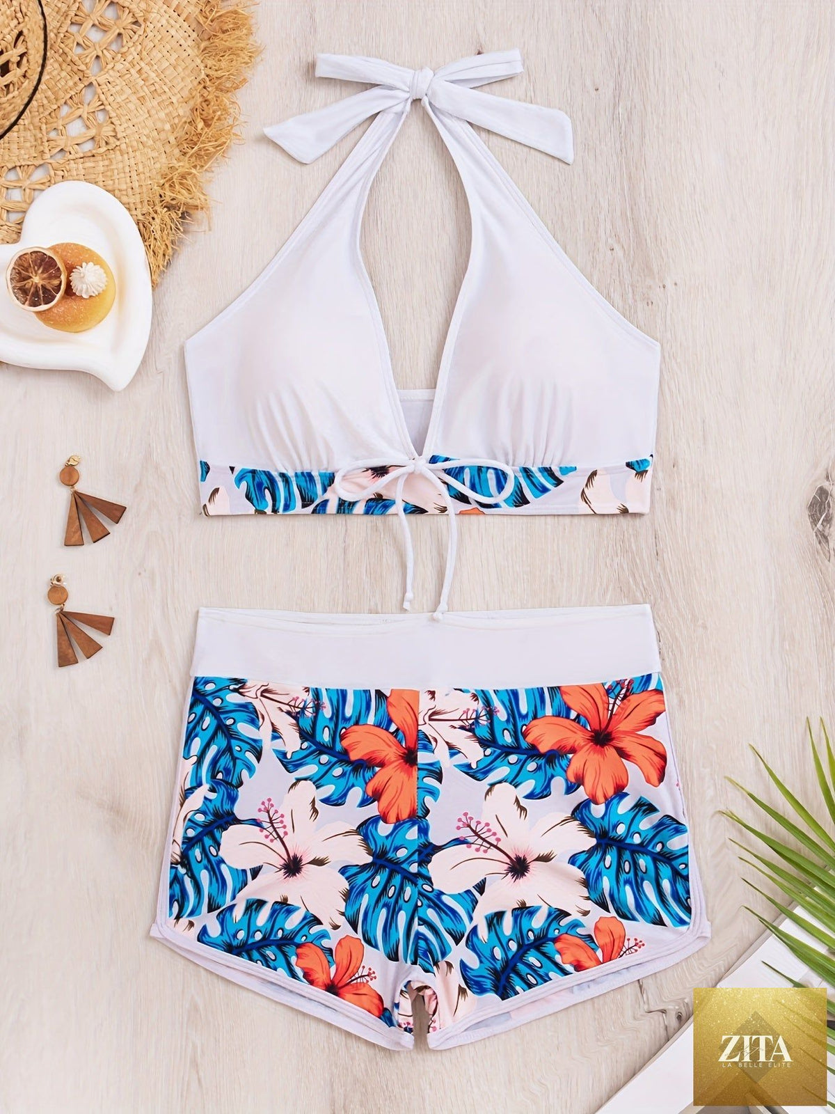 Stevvex floral halter neck bikini set featuring backless design, tie-neck bow, and high waist bottoms, perfect for summer beachwear.