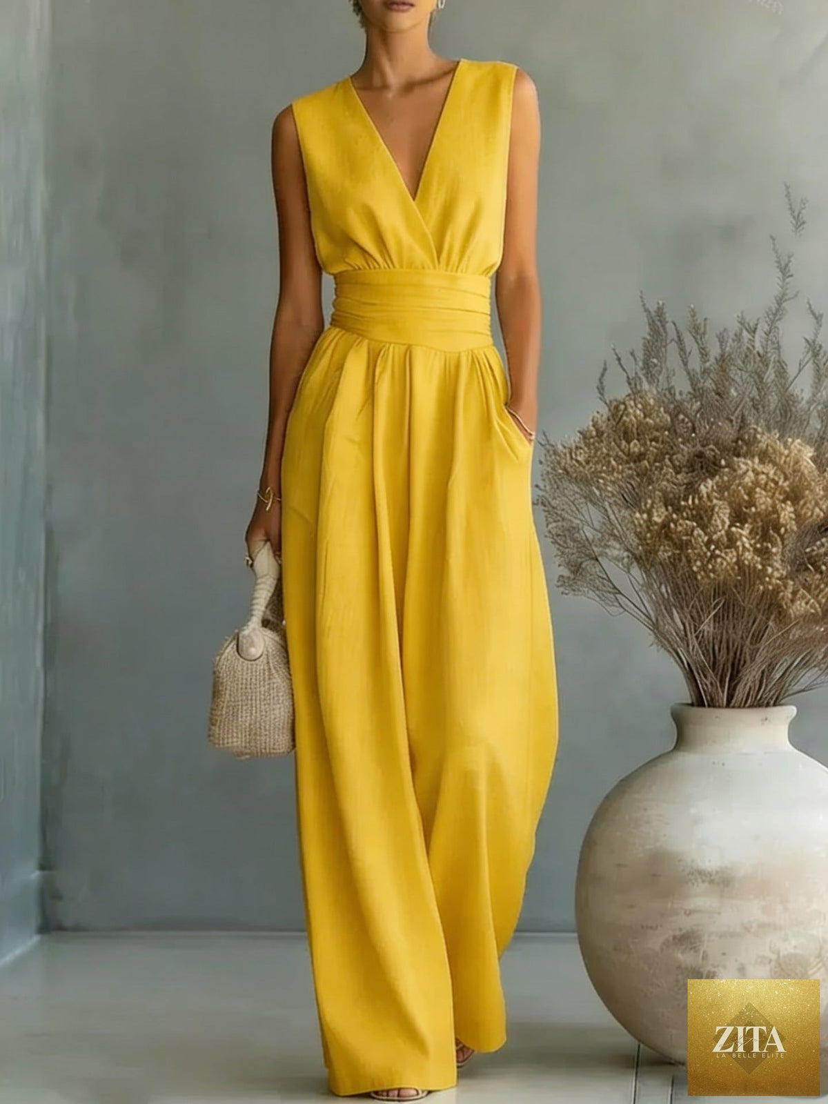 Women's elegant V-neck sleeveless jumpsuit by Zita La Belle Elite featuring a waist-cinching fit and straight-leg design.