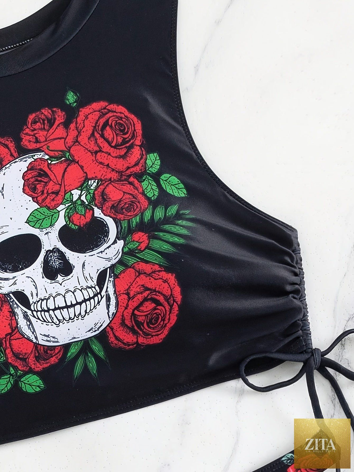 Stevvex bikini set featuring skull print, floral tie, lace-up design, and hollow-out details for beach and summer festivals.