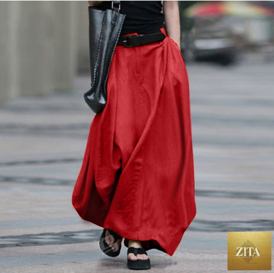 Women's high-waist flared maxi skirt by FitiqueFit in solid cotton linen with side pockets, perfect for casual wear.