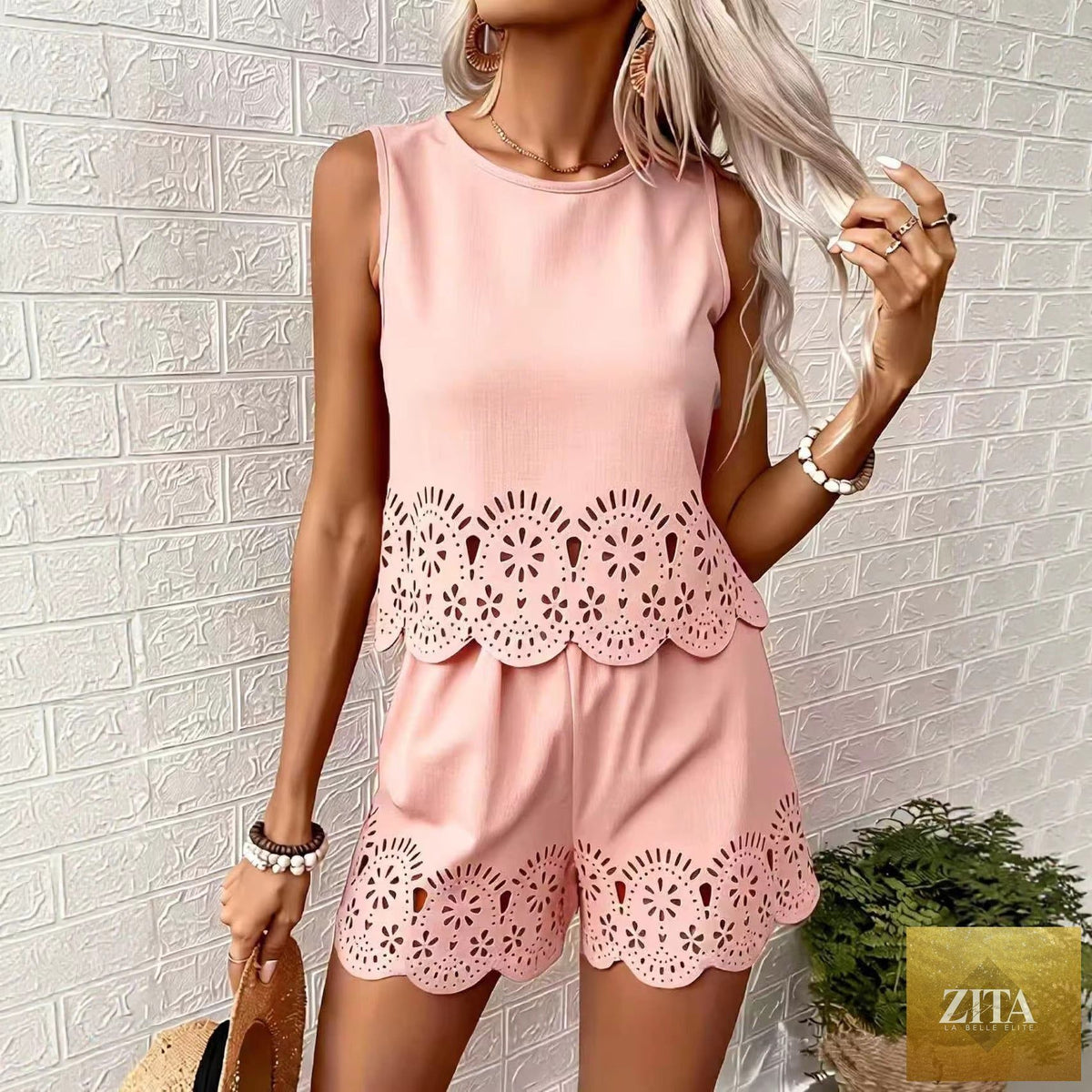 Women's elegant hollow-out floral top and pants set by Zita La Belle Elite, featuring casual floral design and stylish two-piece fashion.