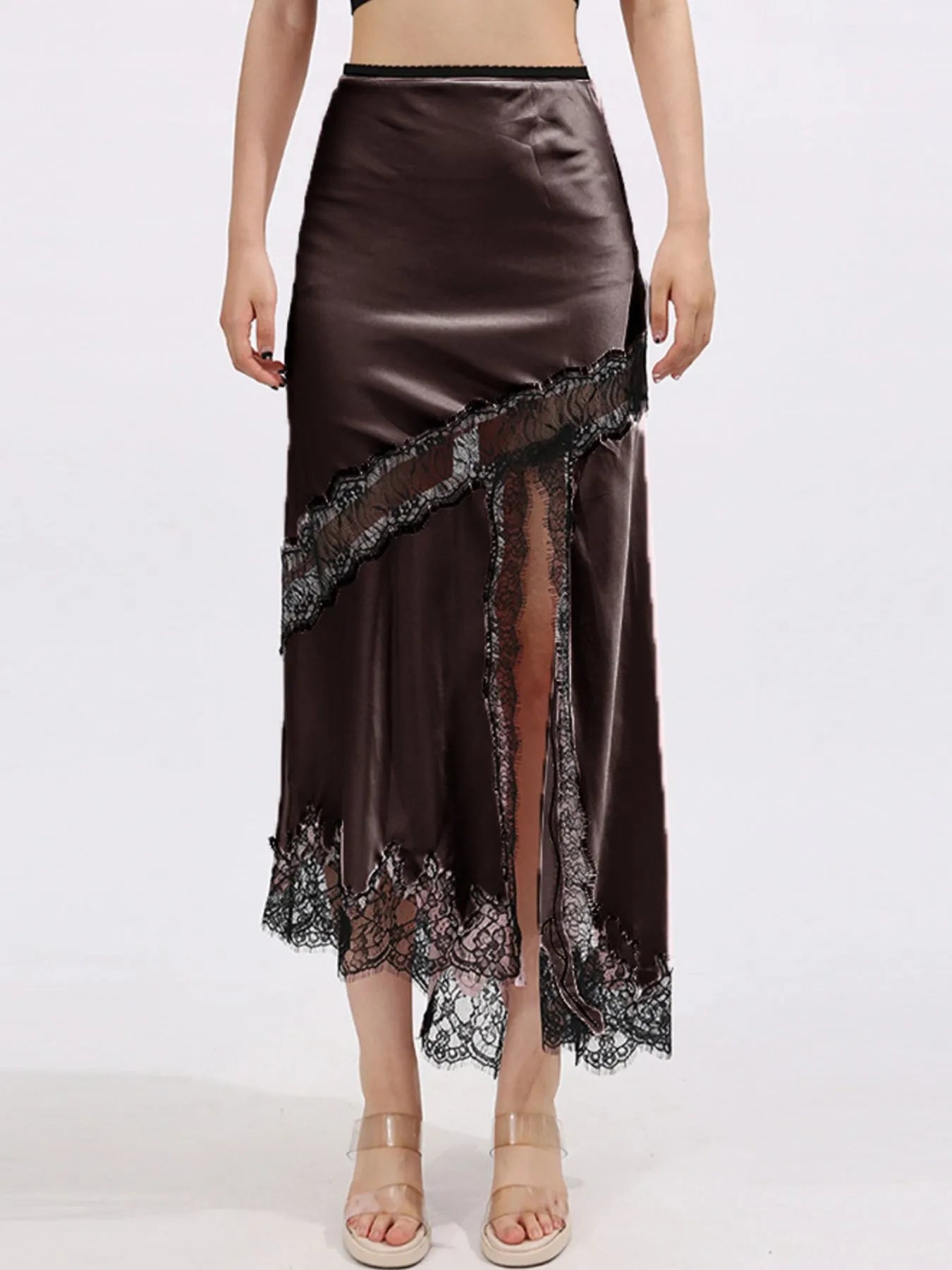 Lace trim asymmetrical midi skirt by The Fashion Celestial featuring flowing fabric and elegant design, shown from the side.