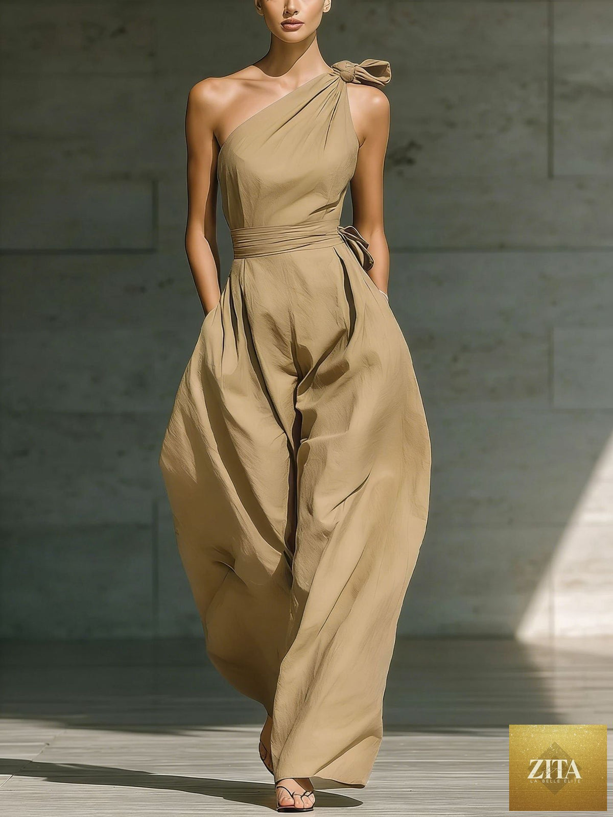 Women's loose sleeveless off-shoulder belt jumpsuit by Zita La Belle Elite, featuring wide-leg casualwear with a relaxed fit.