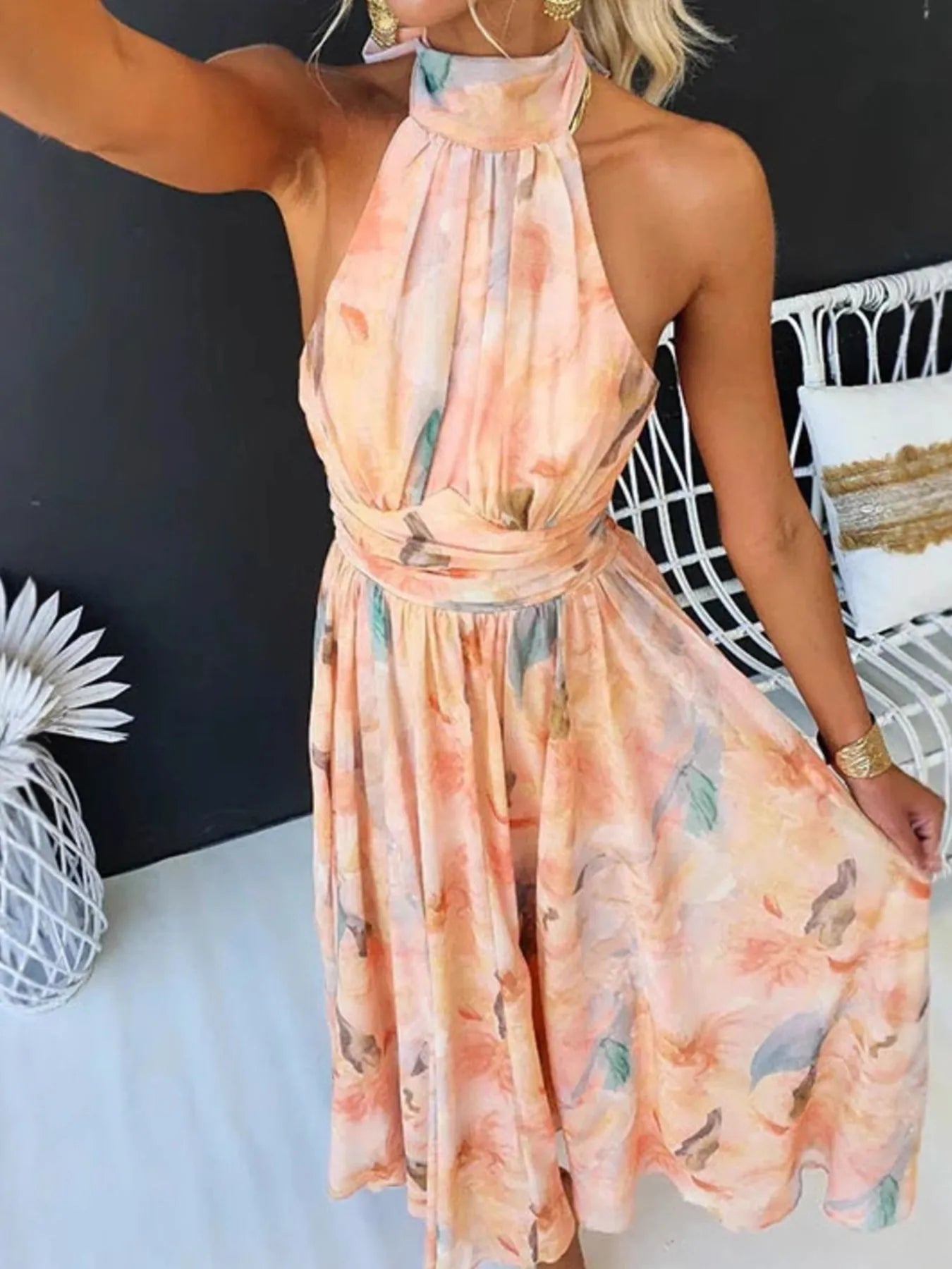 Floral halter neck backless summer dress by Shopiebay, featuring vibrant flower patterns and lightweight fabric.