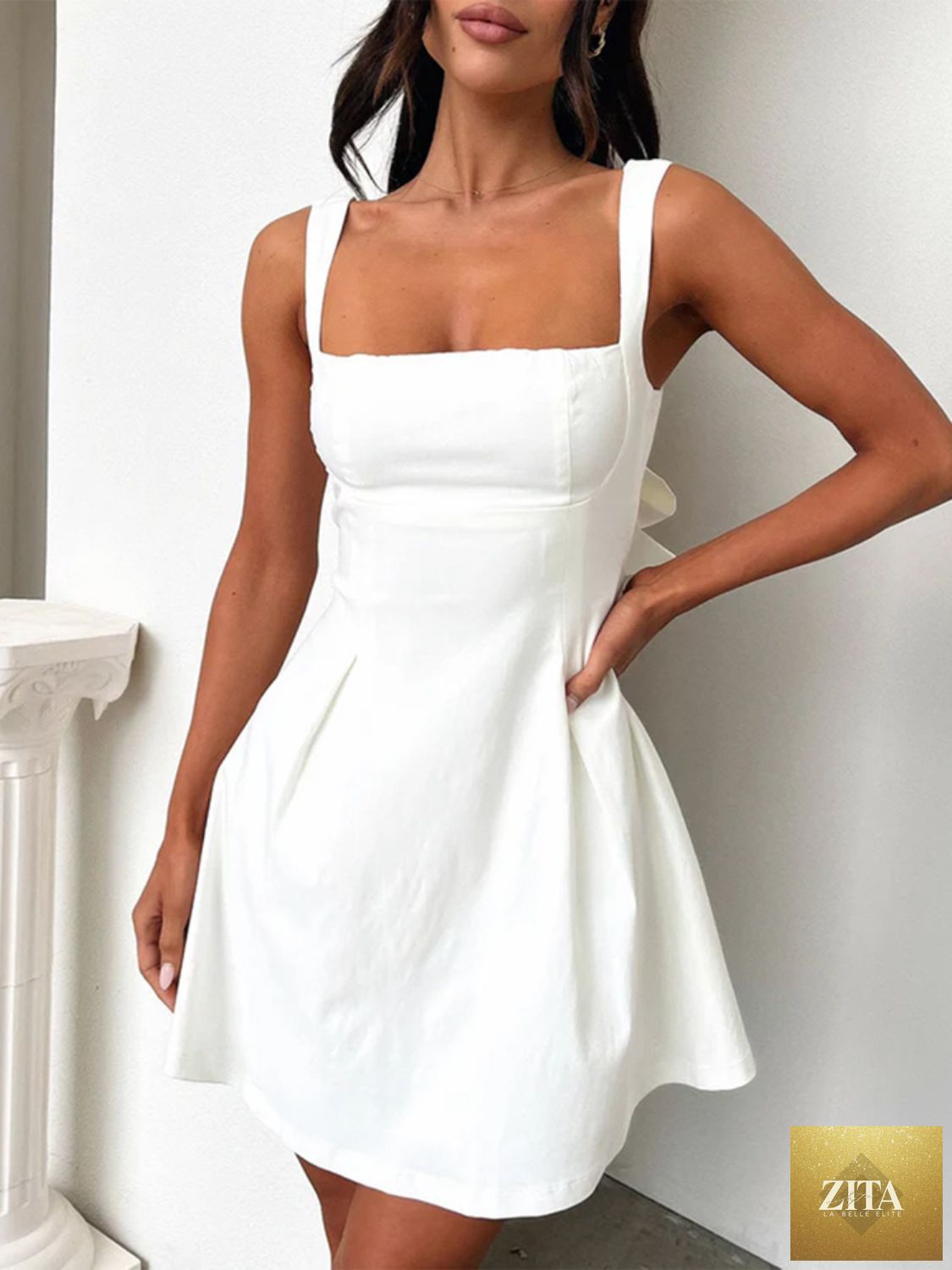 Dark blue Stevvex bow back square neck mini dress with a feminine, flattering fit, perfect for girls' stylish occasions.