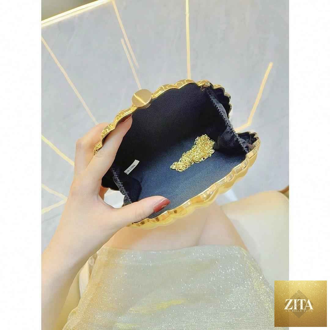 Elegant women's seashell acrylic clutch by SHOMICOBOUTIQUE featuring metallic finish, perfect for parties and evening events.
