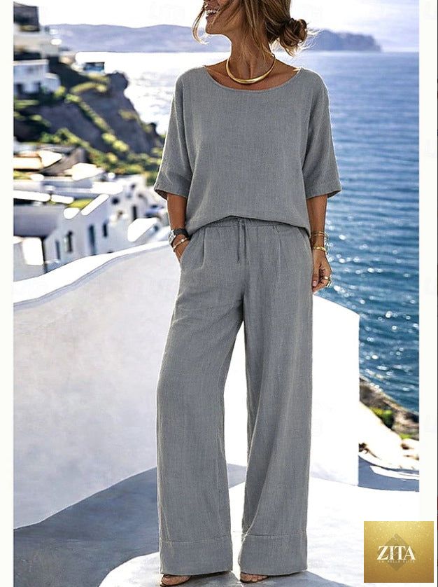 Women's cotton linen resort set by Zita La Belle Elite with short sleeve top and wide-leg pants, perfect for warm weather.