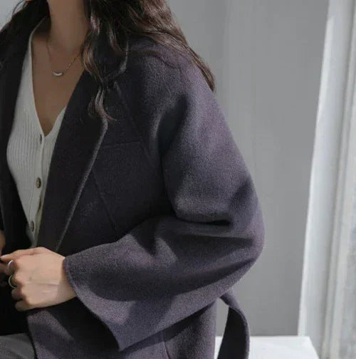 Femstylo women's Korean wool coat for autumn and winter, stylish and elegant jacket with warm, textured fabric.