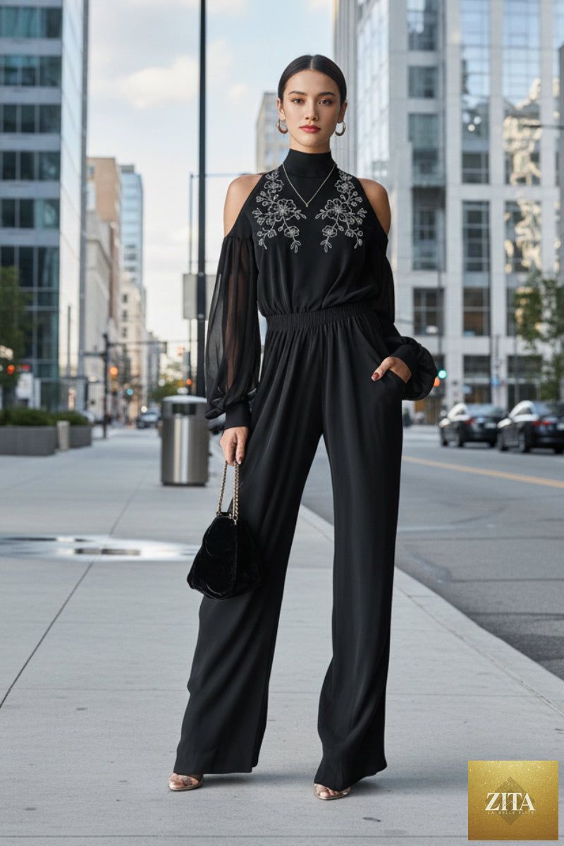 Black embroidered women's long-sleeve wide-leg jumpsuit by Zita La Belle Elite, shown with detailed embroidery and relaxed fit.